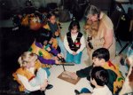 Belinda teaching kids how to use a bow drill.